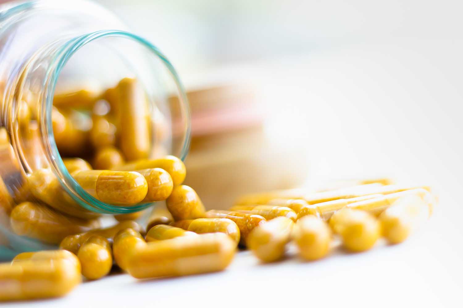 Vitamin D-3 capsules in bottle. Cod liver oil omega 3 gel capsules. Vitamins, dietary supplements, drugs, Pharmacy, medicine and health concept. capsule pharmacy bottle pill drug concept.