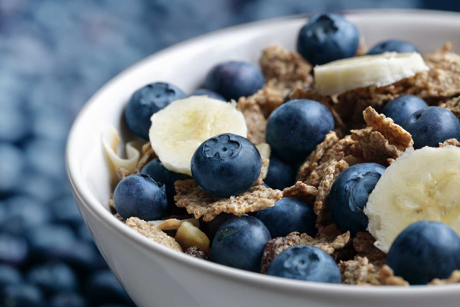 Healthy breakfast with high fibre bran flakes, blueberry and banana