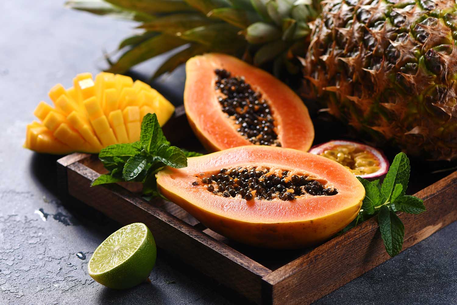 Papaya fruit, sweet ripe fresh papaya, mango, pine apple, raw vegan food, tropical fruits