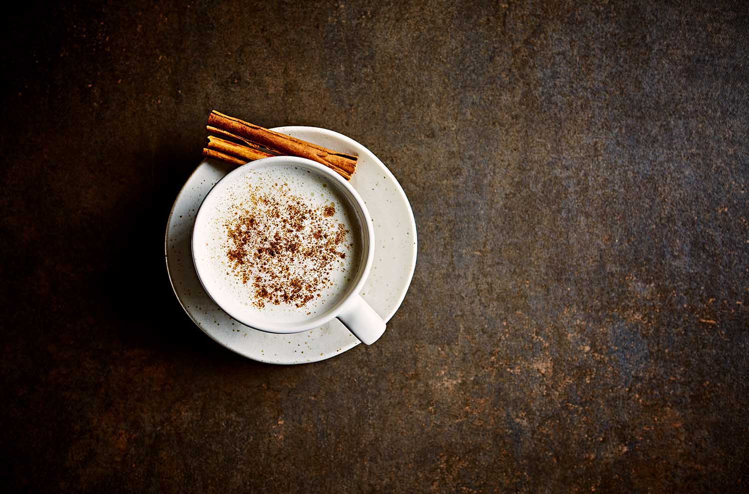 Moon milk with ashwagandha and cinnamon for better sleep. From top. Copy space