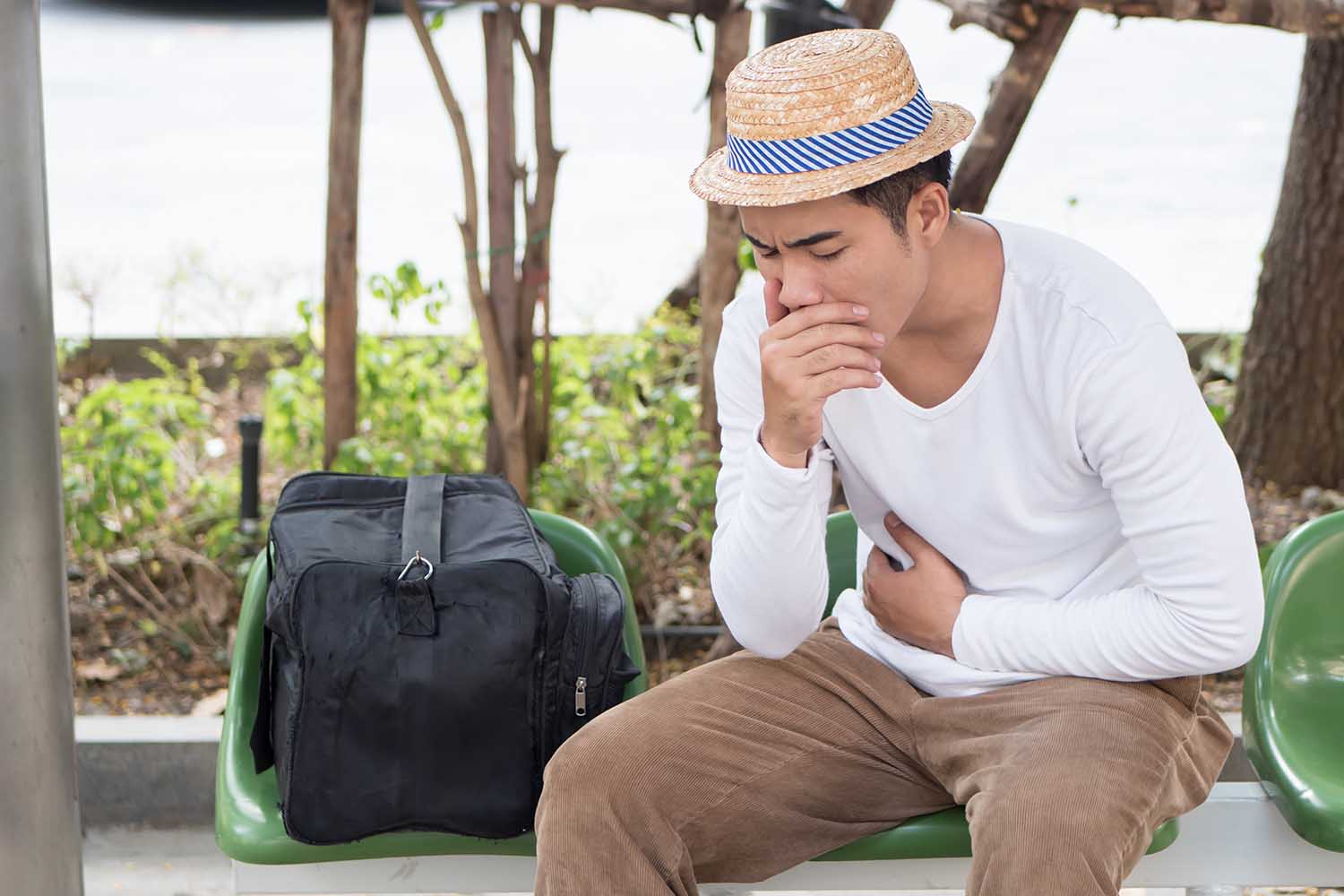 sick man traveler with nausea, stomachache, vomit, acid reflux