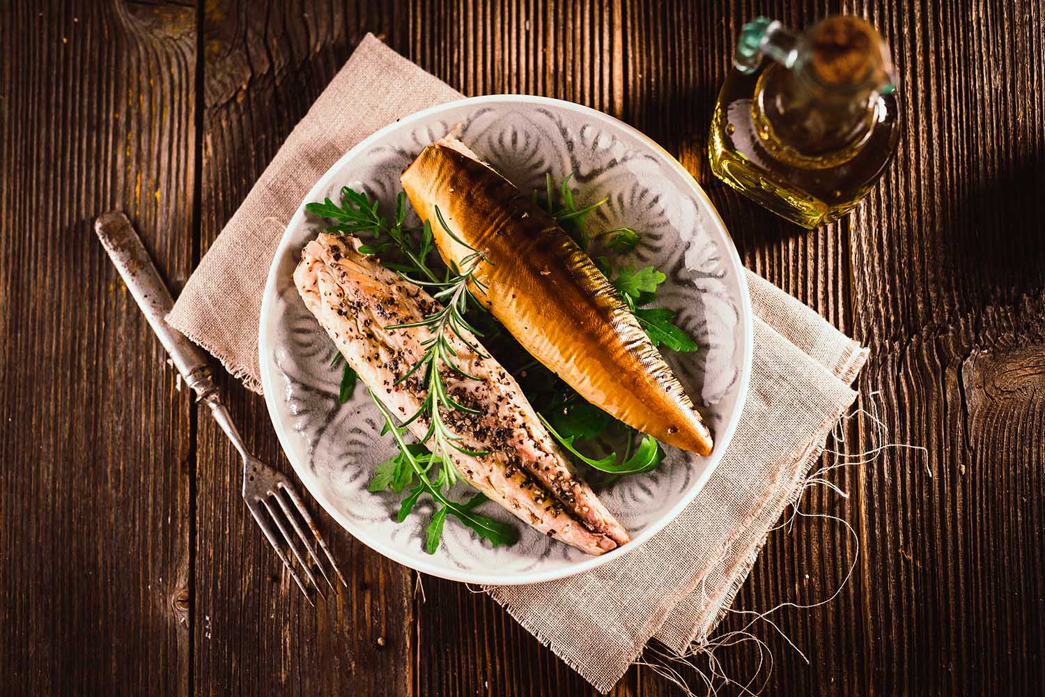 Smoked mackerel on wooden background