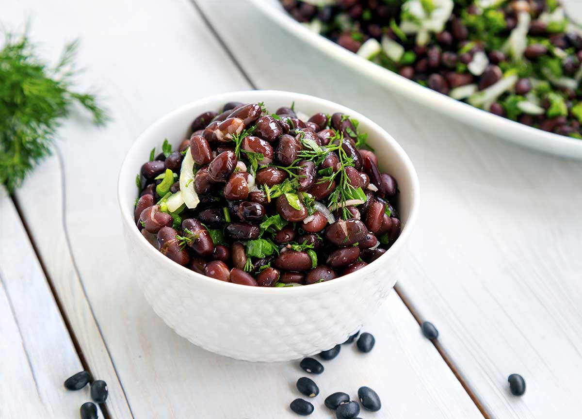 Black bean salad on white background.