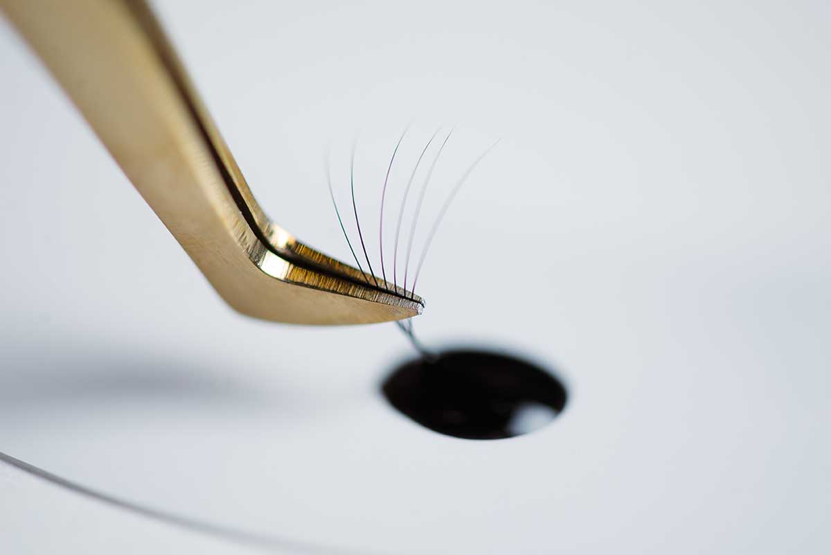 Eyelash extensions in the beauty salon. The concept of body care and beauty.