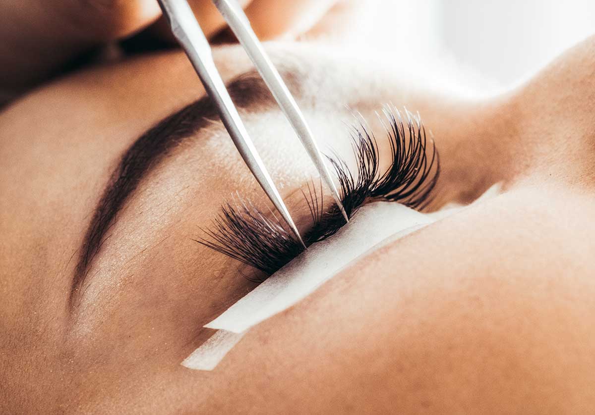 Beautician making artificial lashes. eyelash extension procedure