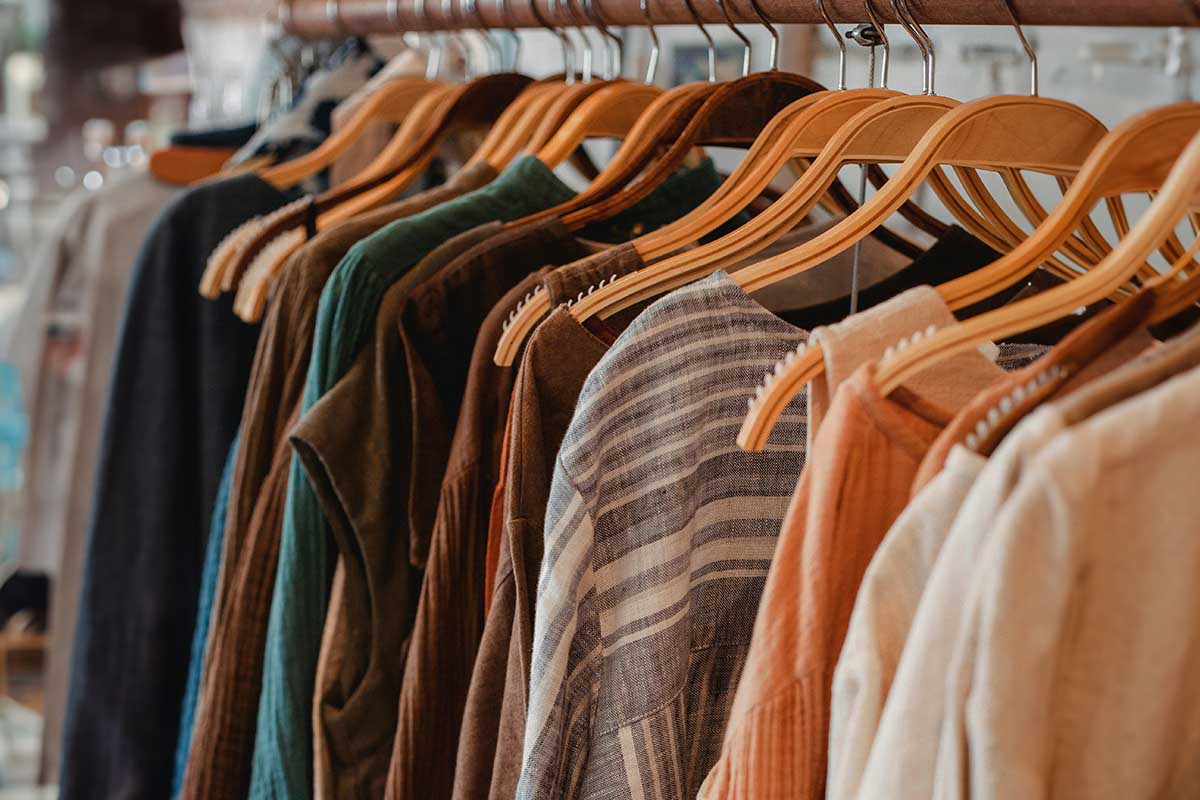 Clothing hanging on a rack in a show