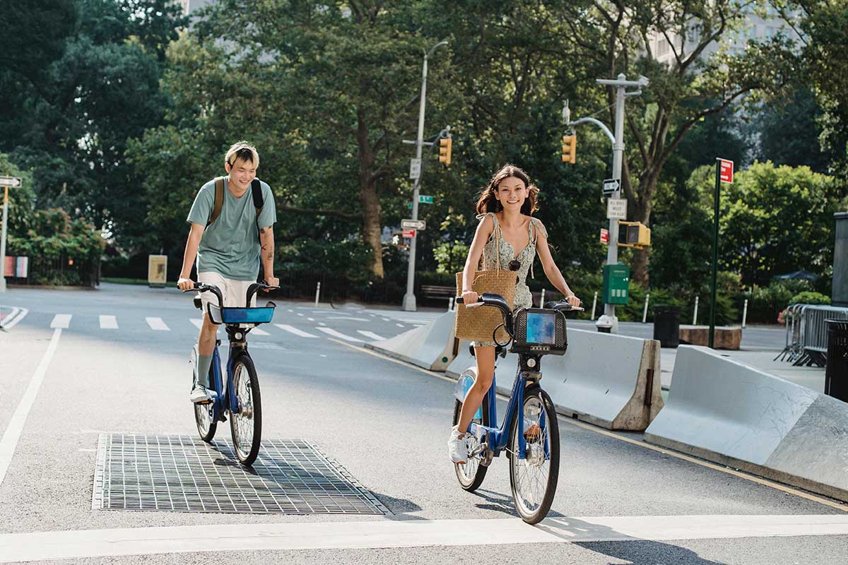 A couple riding bikes in a city