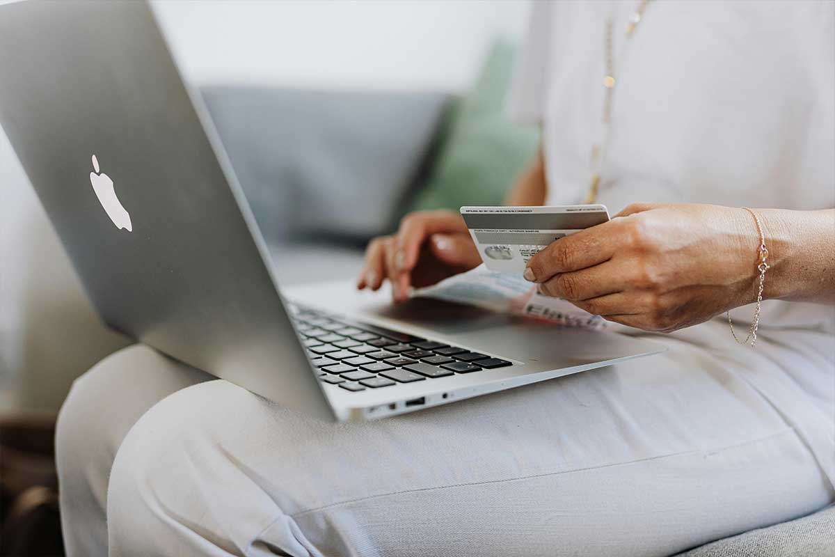 Person shopping online with a credit card