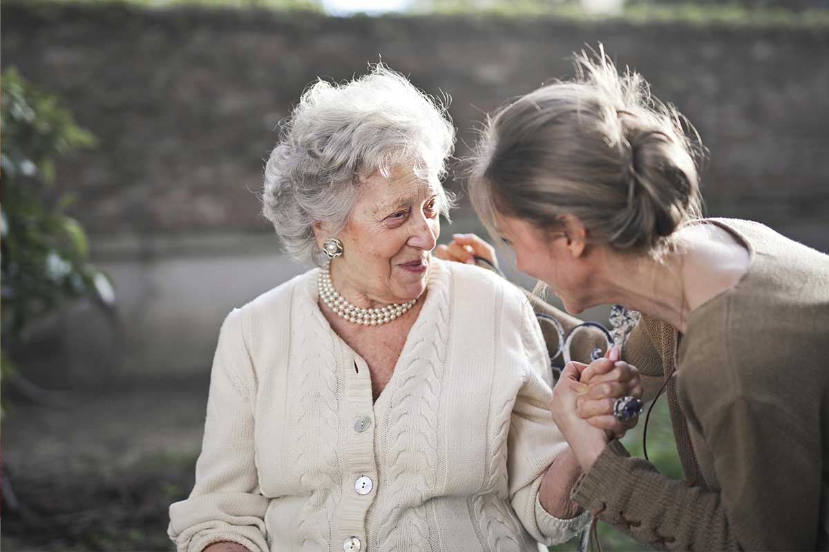 Young woman and older woman talking